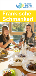 Zwei junge Frauen beim Essen in einem sonnenerhelltem Raum 